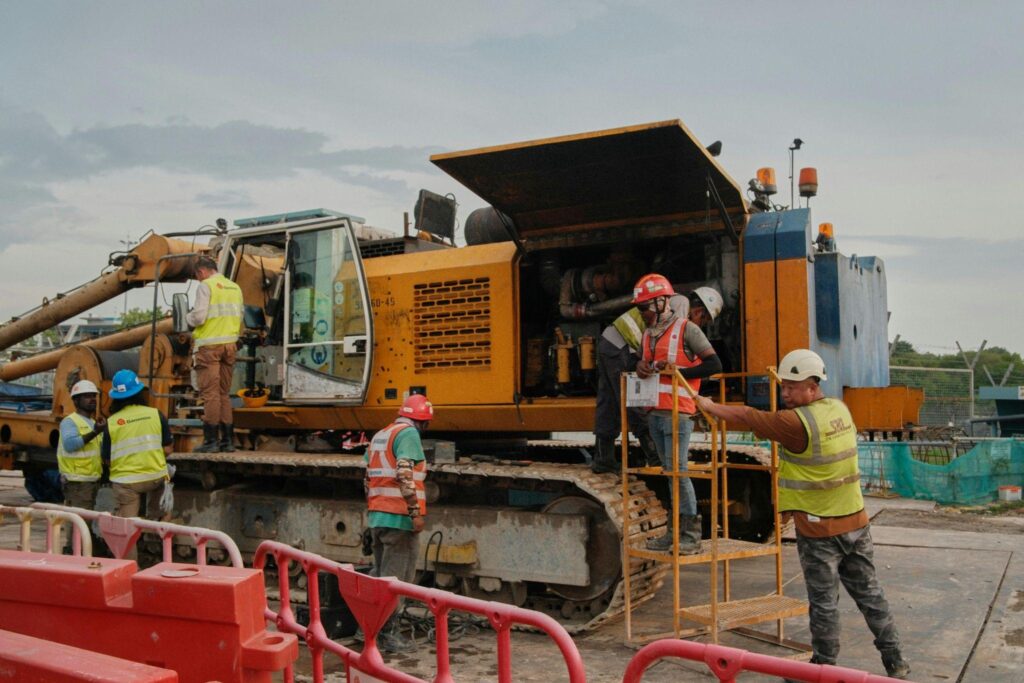 Oilfield crew preparing fusion equipment at an active job site